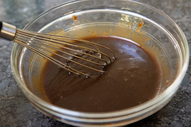 balsamic dressing in a bowl with whisk