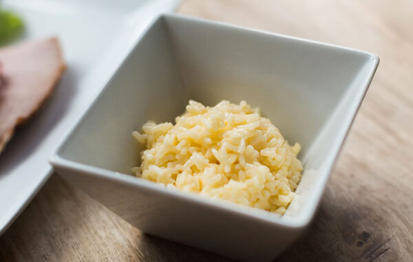 Cheesy rice in a square bowl